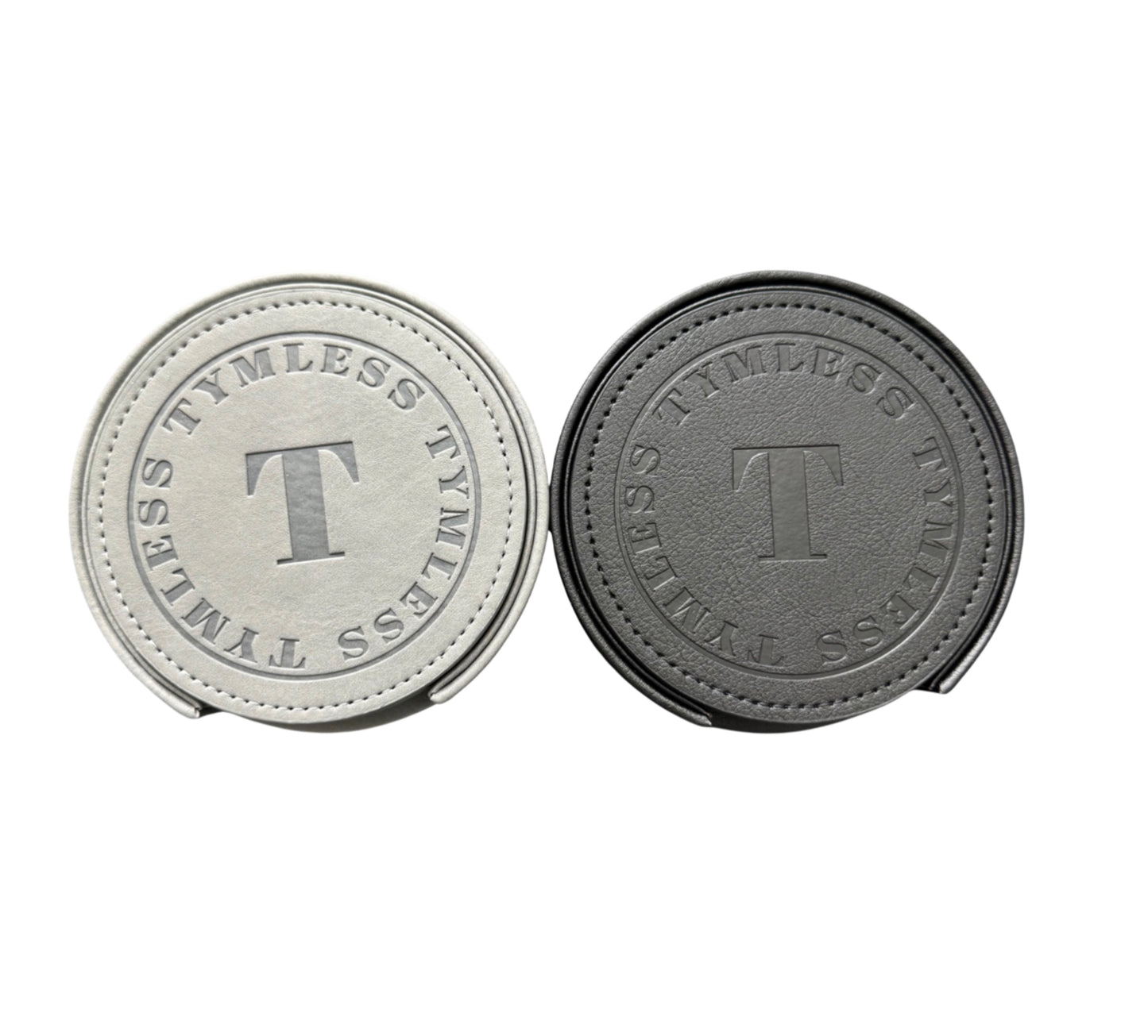 Two coasters in black and silver with 'T' branding
