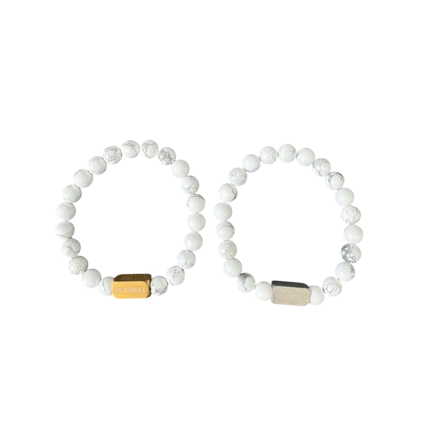 Pair of white marble beaded bracelets with gold and silver engraved metal accents
